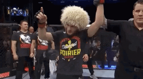 Man In Black Shirt With Pourier In Ring GIF