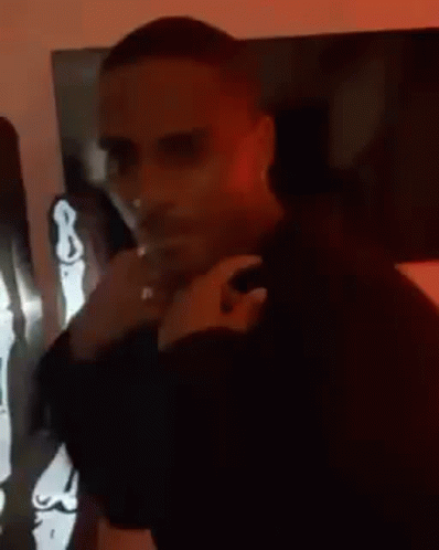 Man In Black Shirt With Skeleton Statue GIF