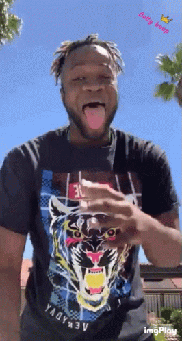 Man in Black Shirt With Tiger Sticking Out Tongue