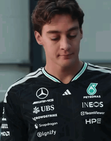 Man in Black Shirt with UBS Snapdragon INEOS