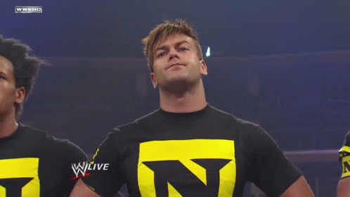 Man in Black Shirt With Yellow Letter N