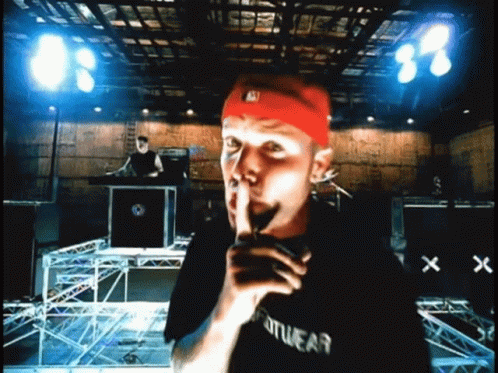 Man In Black Sportswear Shirt Shushing GIF