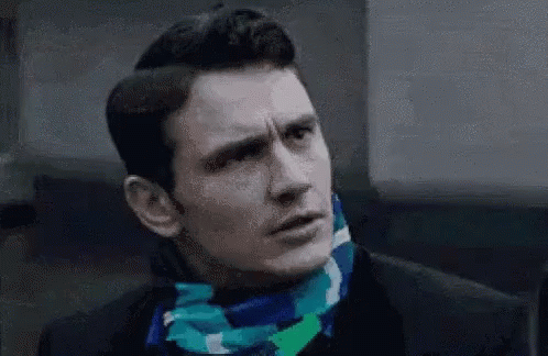 Man In Black Suit And Blue Scarf GIF