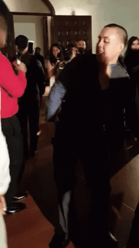 Man in Black Suit Dancing