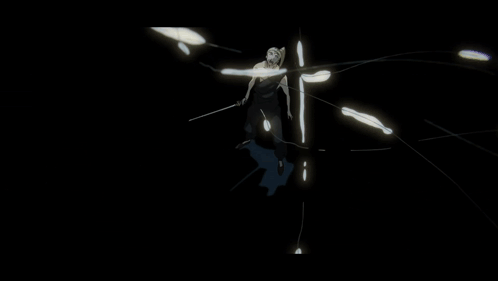 Man In Black Suit In Front Of Large Sculpture GIF