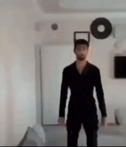 Man in Black Suit in Living Room