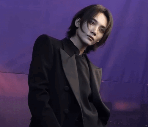 Man in Black Suit in Purple Background