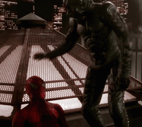 Man in Black Suit Next to Spider Man in Red Suit