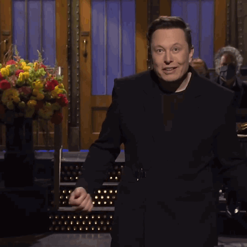 Man in Black Suit With Flowers
