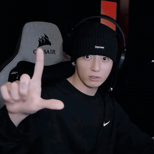 Man In Black Supreme Beanie Pointing At Camera GIF