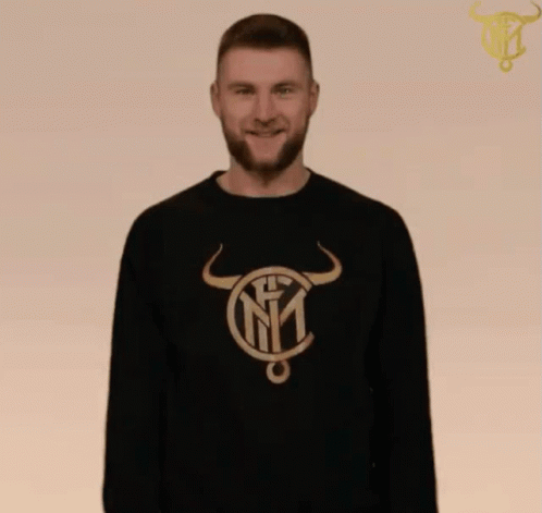 Man in Black Sweater Bull and Letter N