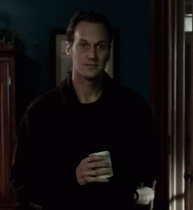 Man in Black Sweater Holding Coffee Cup
