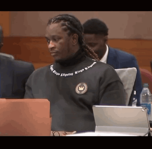 Man In Black Sweater Saying Kings On Neck GIF