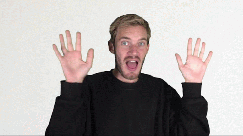 Man in Black Sweater with Funny Face and Hands Raised