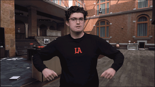 Man in Black Sweater with Ia Letter