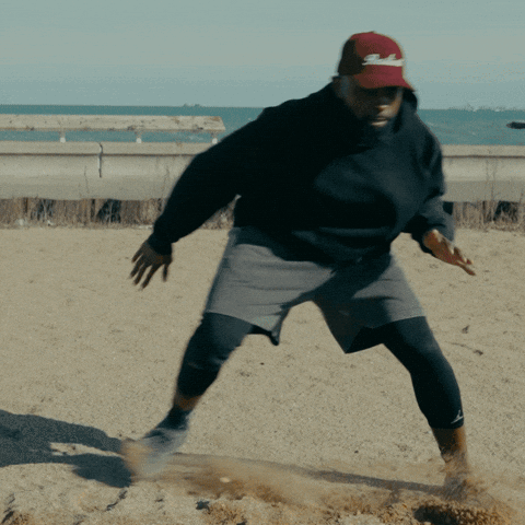 Man in Black Sweatshirt and Red SD Hat