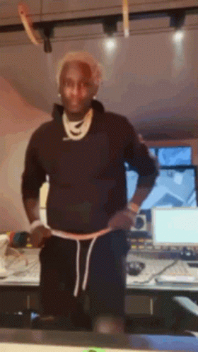 Man In Black Sweatshirt And Shorts Before Computer Monitor GIF