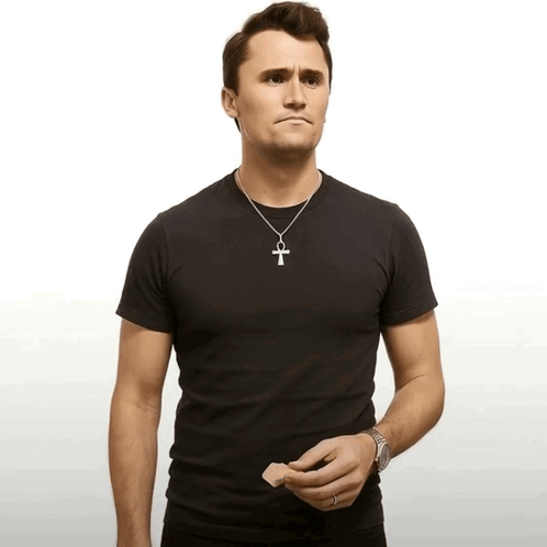 Man in Black T-Shirt and Silver Cross Necklace
