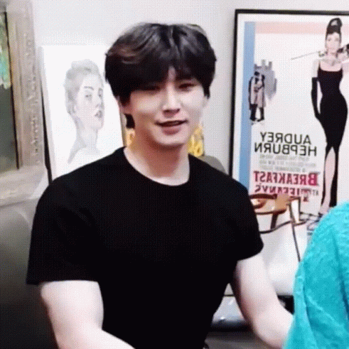Man In Black T-Shirt In Front Of Y3aqua Poster GIF