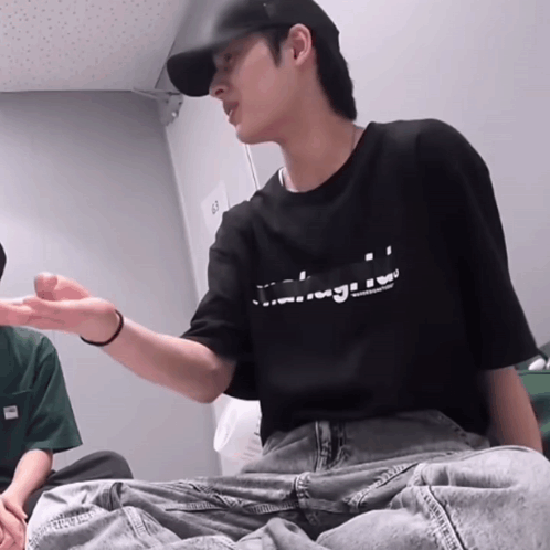 Man In Black T-Shirt Sitting GIF