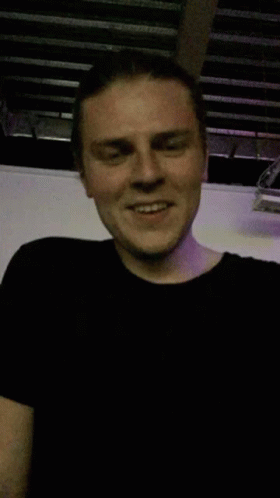 Man in Black T-Shirt Smiling