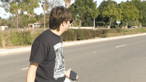 Man In Black T-Shirt With Skull GIF