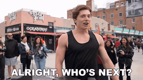 Man In Black Tank Top At Oceanfront Building GIF