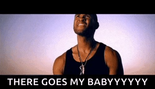 Man In Black Tank Top Beside Sign That Says There Goes My Babyyyy GIF