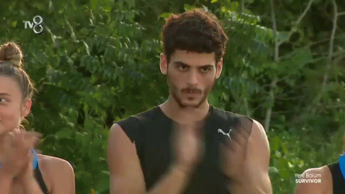 Man in Black Tank Top Clapping