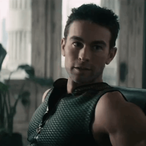 Man in Black Tank Top Sitting