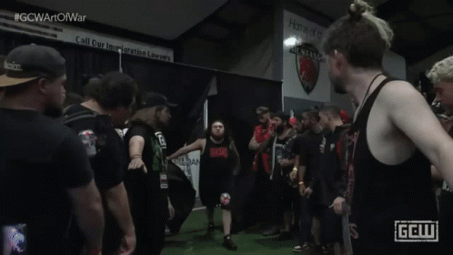 Man in Black Tank Top With Red GCW Logo