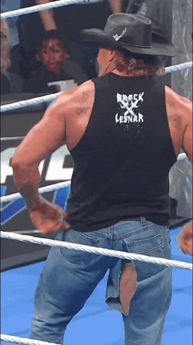 Man in Black Tank Top with Rock Lesnar