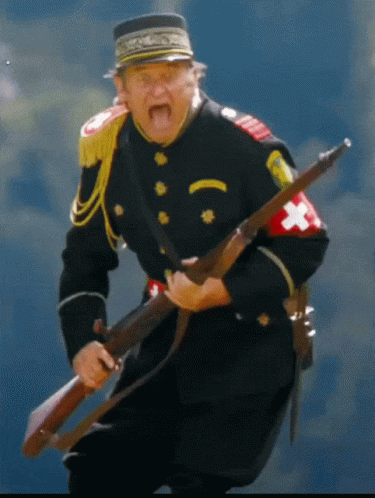 Man in Black Uniform Holding Gun