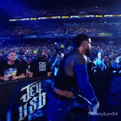 Man In Black Vest Blue Shorts Crowd Saying Tiffany GIF