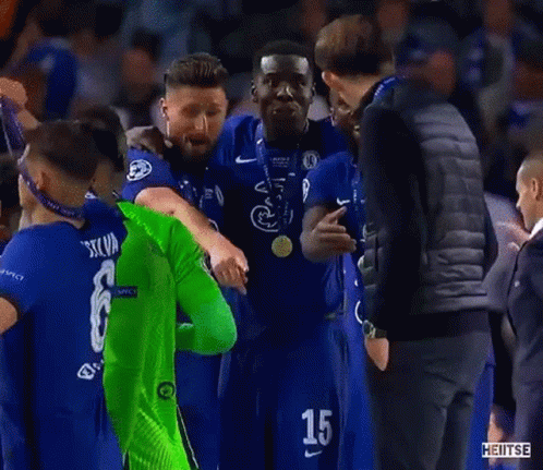 Man In Black Vest Next To Man In Green Soccer Jersey GIF