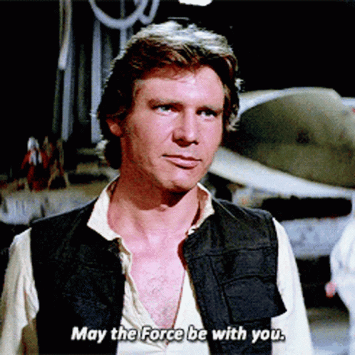 Man in Black Vest Saying May The Force Be With You