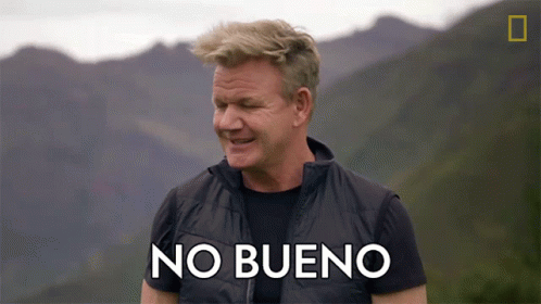 Man in Black Vest Says No Bueno in Mountains