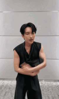 Man In Black Vest With Arms Crossed GIF