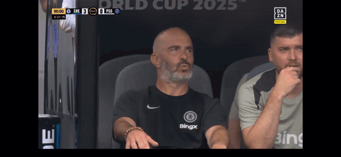 Man In Blingx Shirt Sitting In Stadium GIF