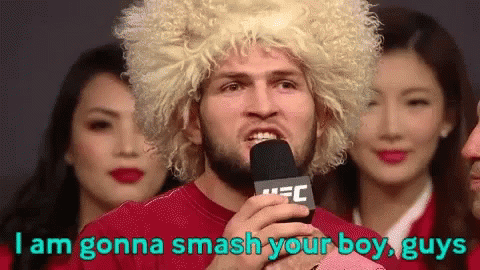 Man In Blonde Wig Holding Microphone Says I Am Gonna Smash Your Boy Guys GIF