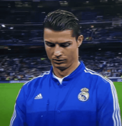 Man in Blue Adidas Jacket Smiles