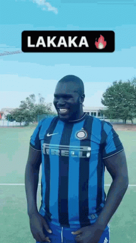 Man in Blue and Black Striped Soccer Jersey