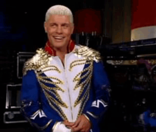 Man in Blue and Gold Costume Smiling