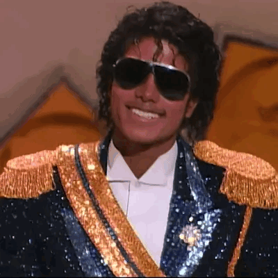 Man In Blue And Gold Jacket Saying Hello Chat GIF