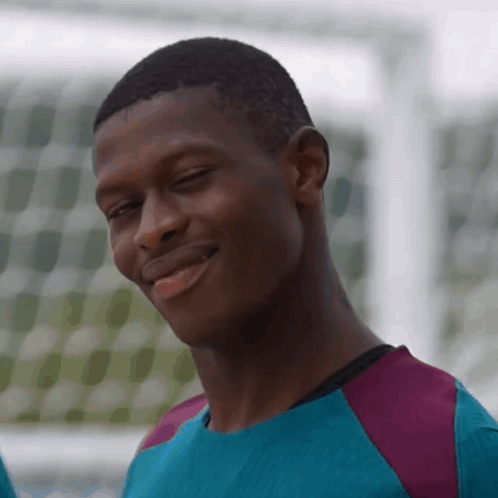 Man in Blue and Purple Smiling Eyes Closed