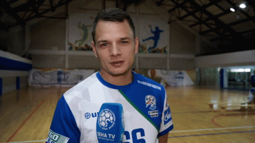 Man in Blue and White Shirt With Number 20