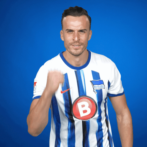Man in Blue and White Striped Jersey with B