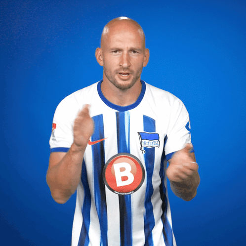Man in Blue and White Striped Jersey With Letter B