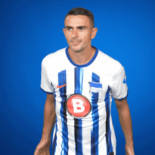Man in Blue and White Striped Shirt with Letter B