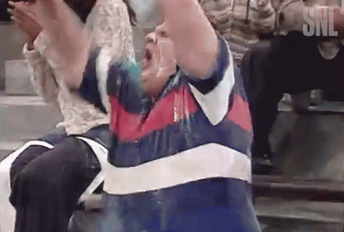 Man in Blue and White Striped Shirt with SNL